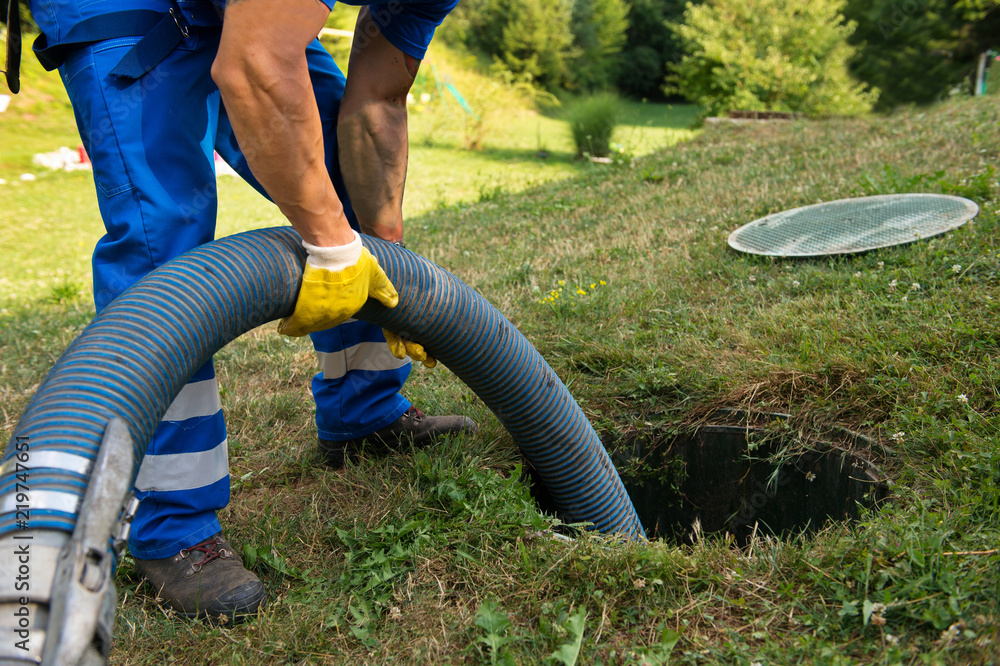 An expert cleaning a septic tank | Septic Tank Service